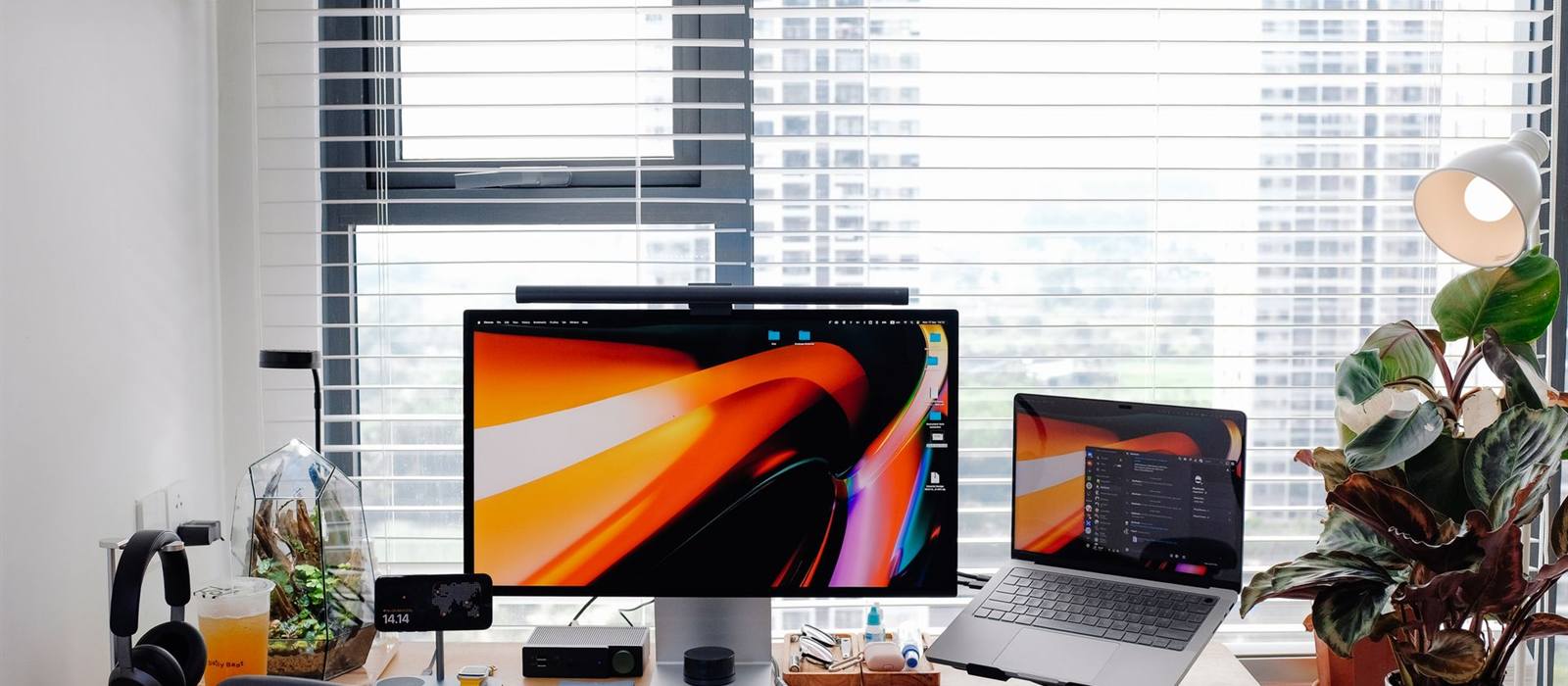 Laptop screen extender website background: home office desk with an external monitor and a laptop